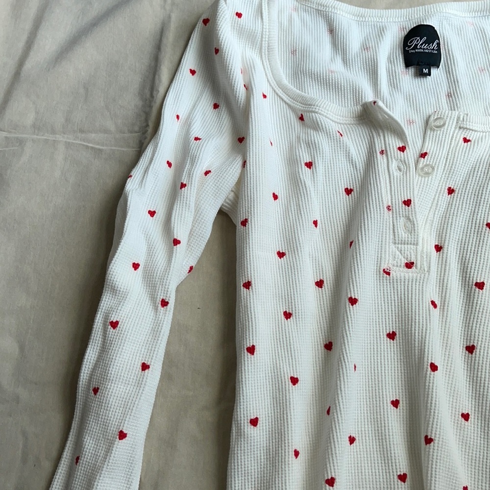 This is a white pajama top with little red hearts!